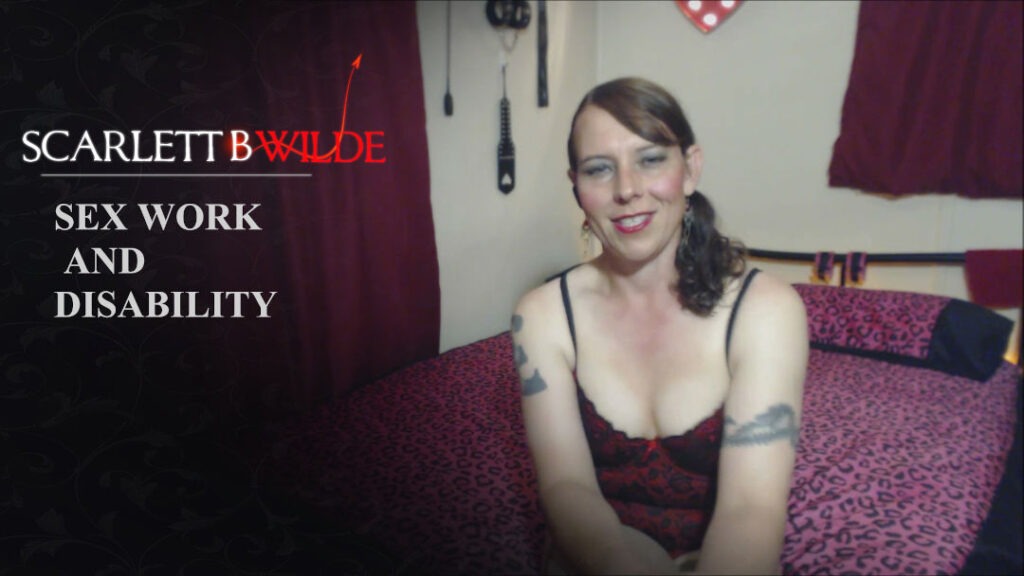 Video still from Vlog of Scarlett B Wilde speaking to camera about sex work and clients with disability. Scarlett wears red lingerie.