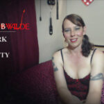 Video still from Vlog of Scarlett B Wilde speaking to camera about sex work and clients with disability. Scarlett wears red lingerie.